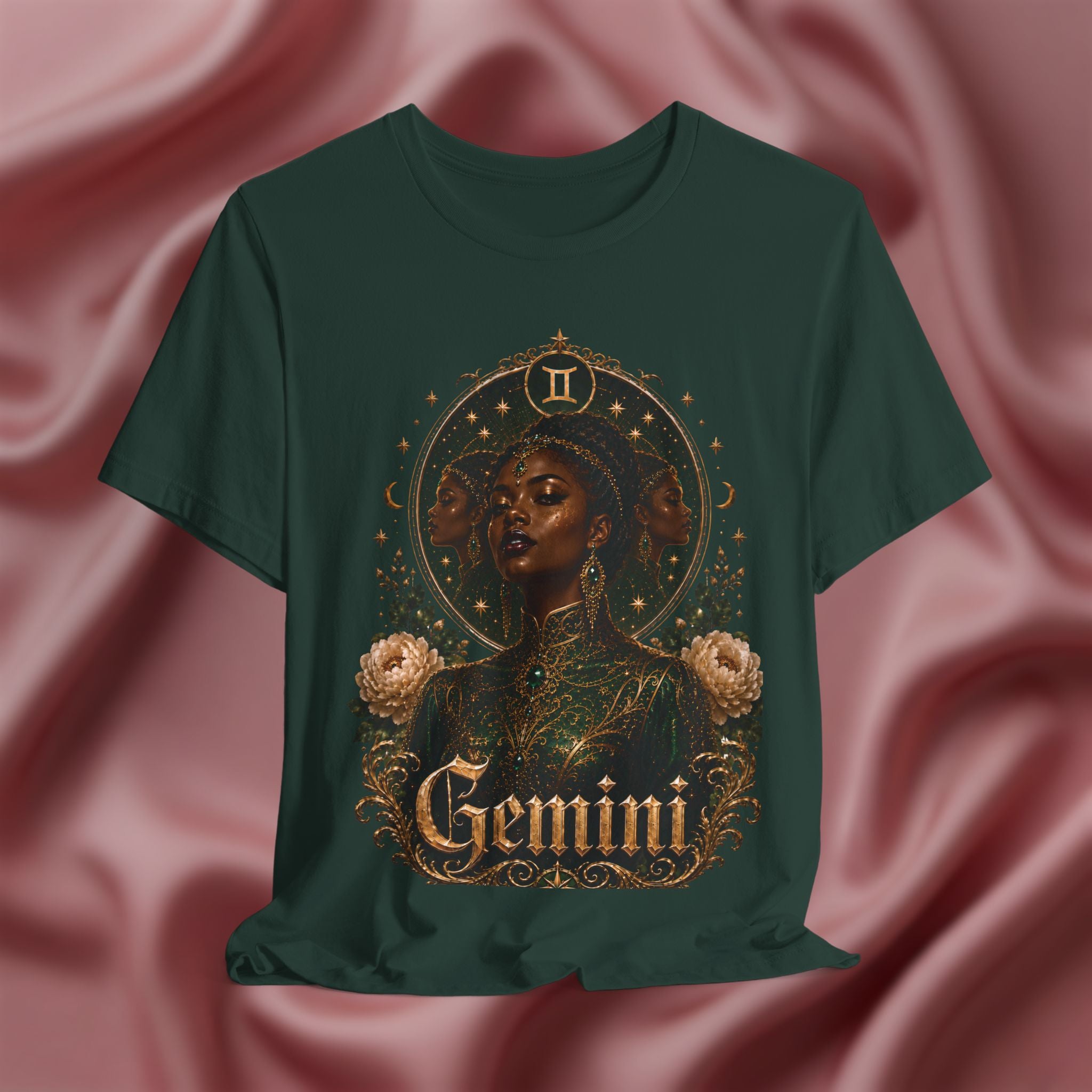 Green t-shirt with 'Gemini' design featuring a woman's face and floral elements on a pink fabric background.
