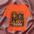 Orange t-shirt with 'Leo Teacher' design featuring a lion and educational elements