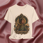 Soft cream T-shirt with Capricorn design on a textured red background