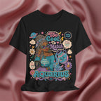 Black t-shirt with Aquarius-themed design featuring a person with braided hair