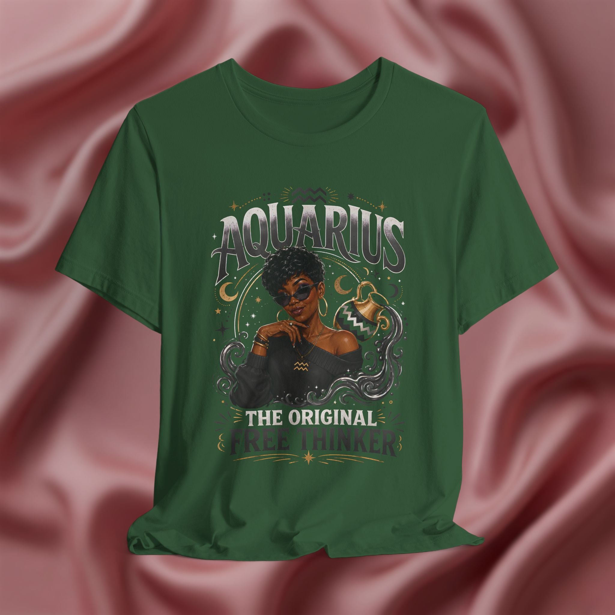 Green t-shirt with Aquarius design featuring a black woman and text 'The original free thinker' on a pink fabric background