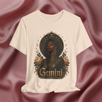 T-shirt with a 'Gemini' design featuring a black woman, roses, and astrological symbols on a textured red background.