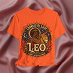 Orange t-shirt with 'Crowned by Light Leo' design