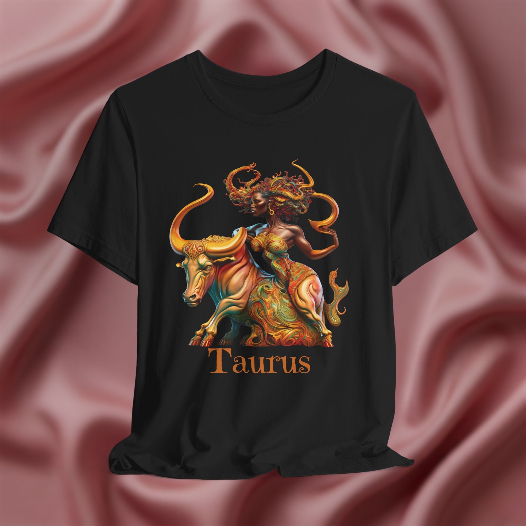 Black t-shirt with Taurus zodiac design featuring a bull and black woman on a pink fabric background