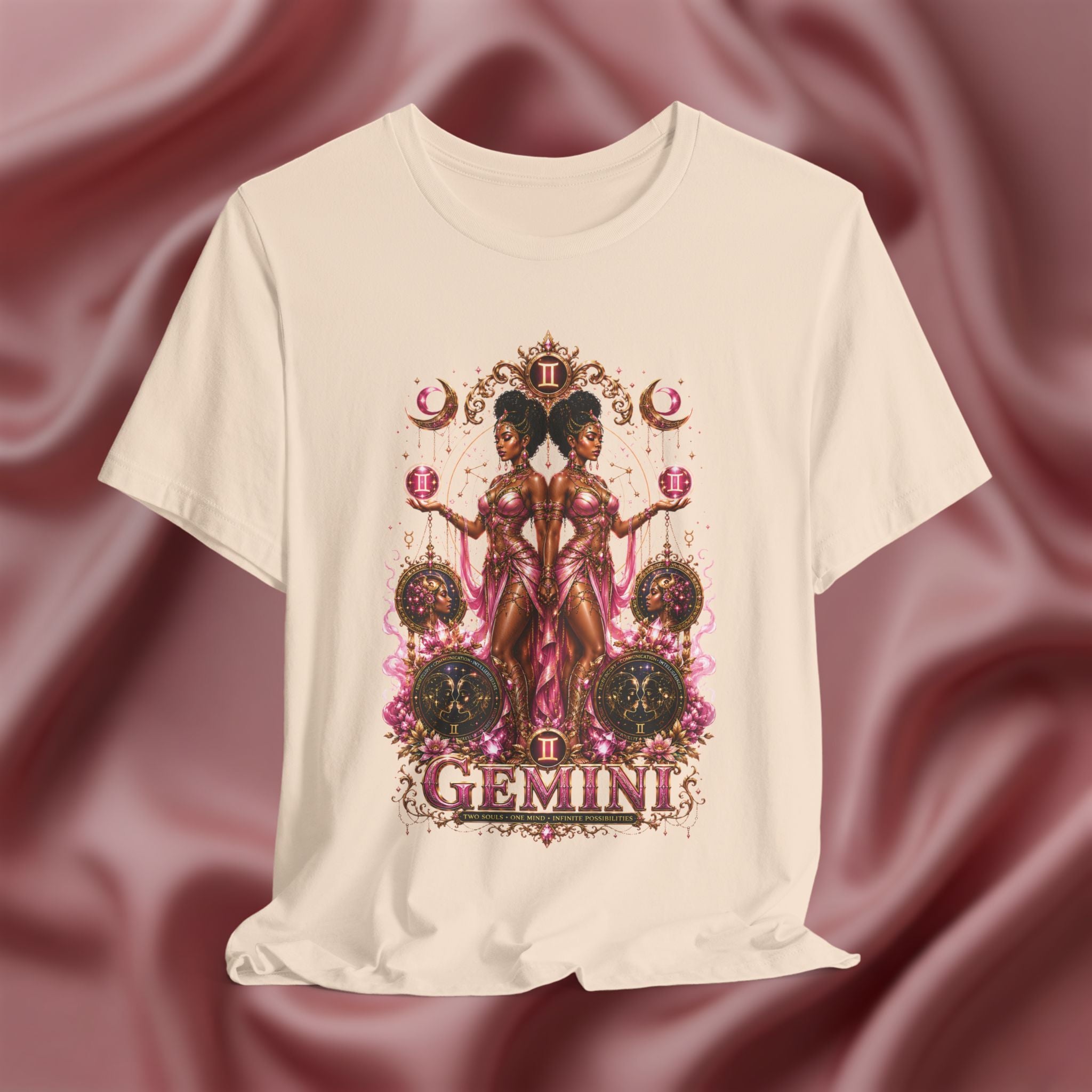 Pink t-shirt with Gemini zodiac design on a textured pink background