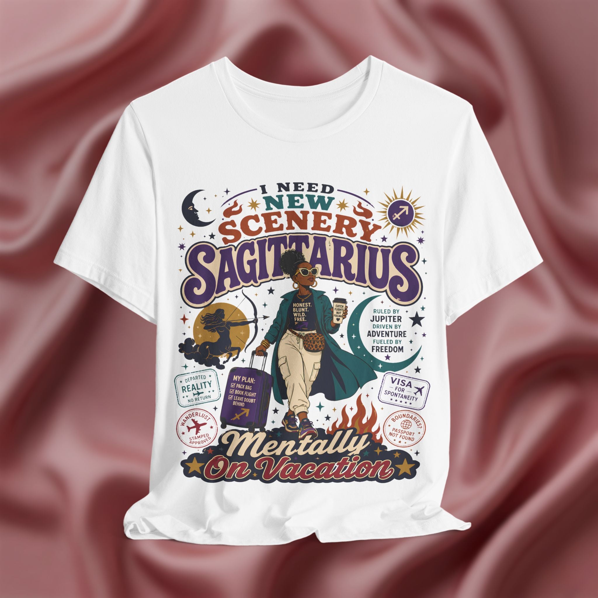 White t-shirt with Sagittarius zodiac design on a maroon fabric background