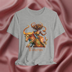 Gray t-shirt with Taurus zodiac design featuring a bull and black woman on a pink fabric background