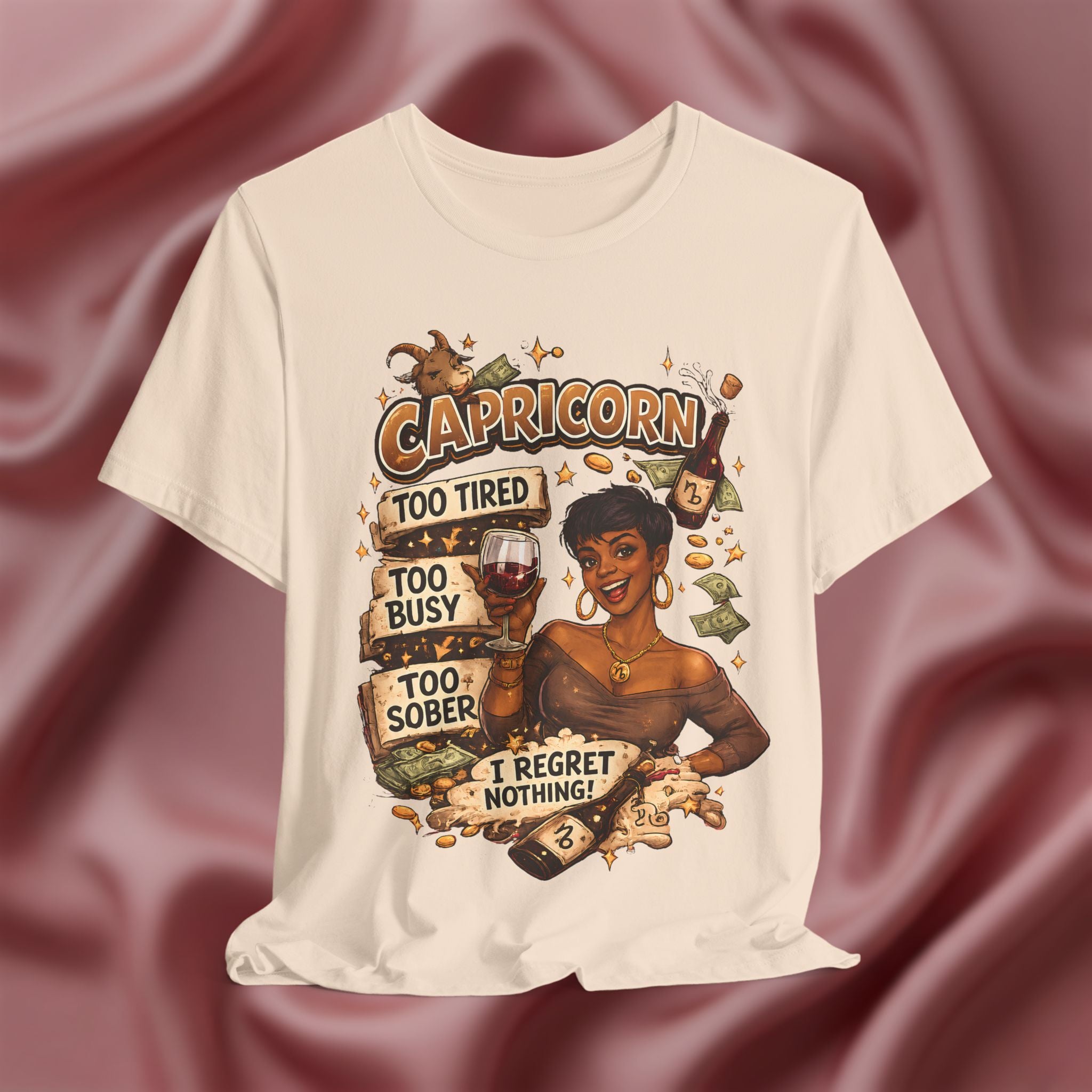 Soft cream t-shirt with Capricorn zodiac design on a maroon fabric background