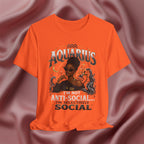Orange t-shirt with Aquarius design featuring a black woman and text 'Aquarius I'm not anti-social I'm selectively social' on a pink fabric background