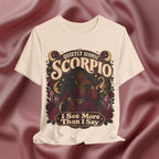 Soft cream T-shirt with Scorpio zodiac design on a maroon fabric background