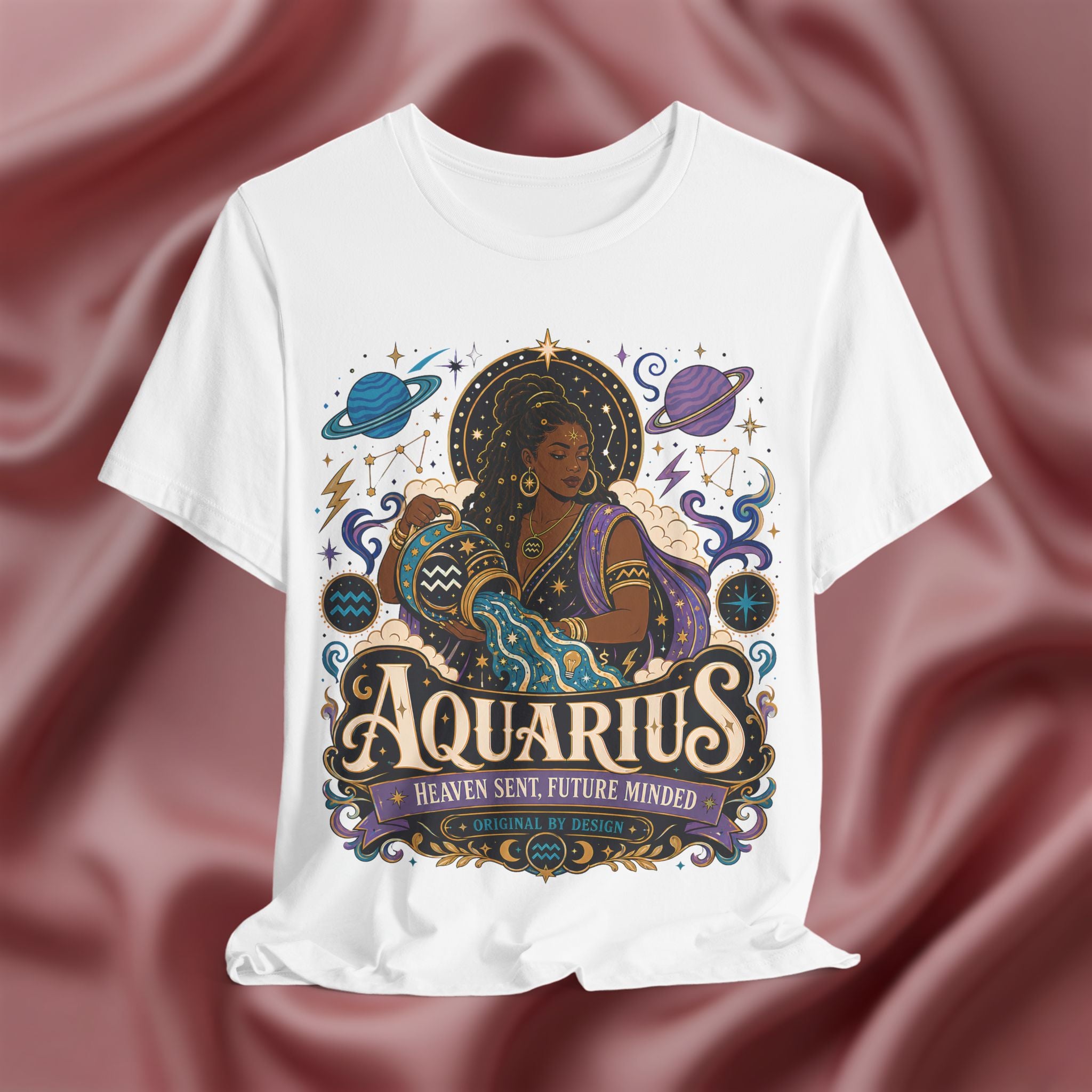 White t-shirt with Aquarius zodiac design on a maroon fabric background