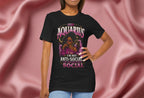 Person wearing a black t-shirt with Aquarius design featuring a black woman and text 'Aquarius I'm not anti-social I'm selectively social' on a pink fabric background