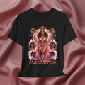 Black t-shirt with 'Gemini' design featuring a woman in a pink dress on a pink fabric background
