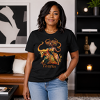 Woman wearing a black t-shirt with a Taurus graphic design featuring a bull and black woman  in a living room setting.