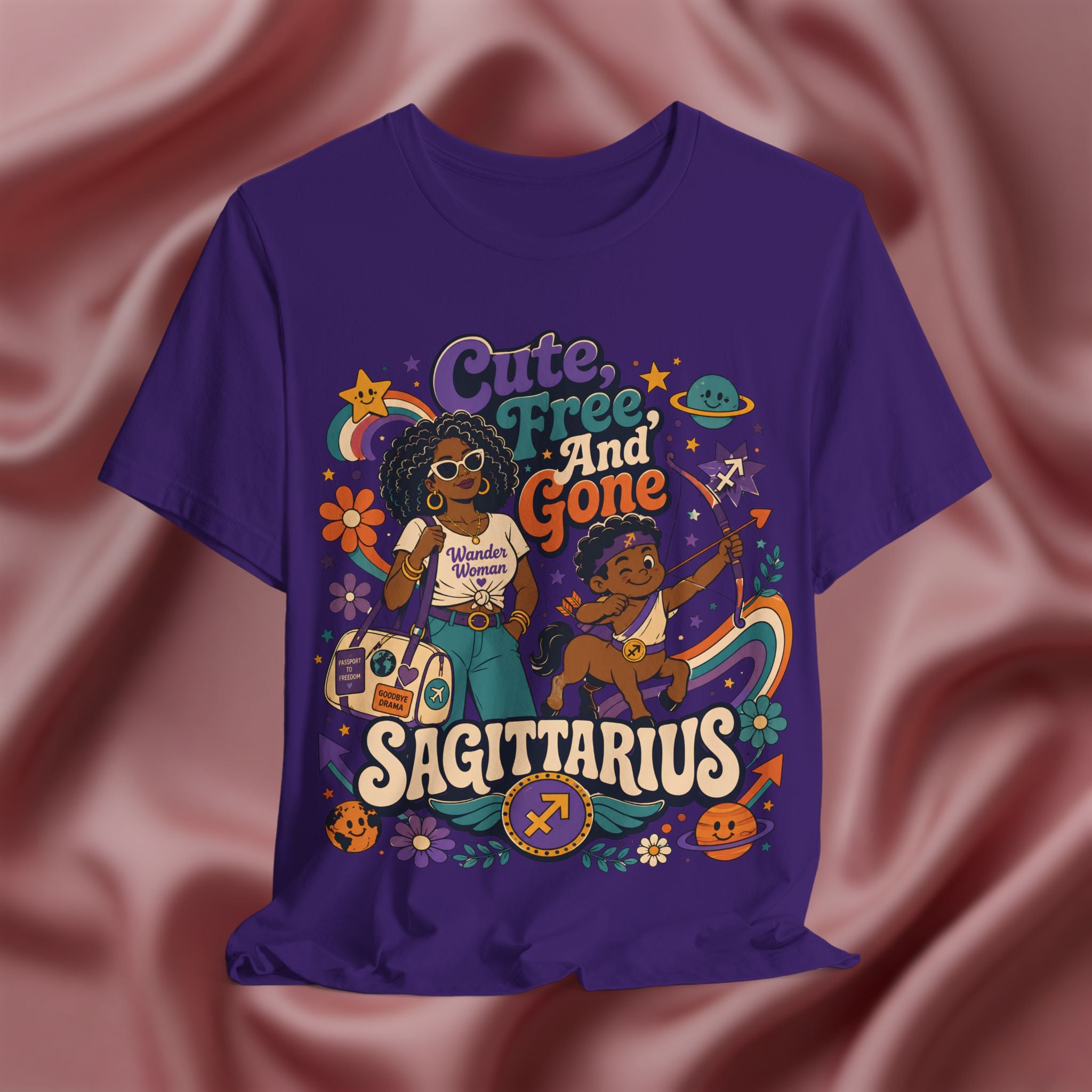 Purple t-shirt with 'Cute, Free, and Gone Sagittarius' design on a pink fabric background