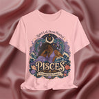 Pink t-shirt with Pisces zodiac design on a maroon fabric background