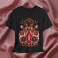 Black t-shirt with 'Gemini twins' design against a pink fabric background