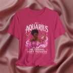 Pink t-shirt with Aquarius design featuring a black woman and text 'The original free thinker' on a pink fabric background