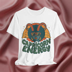 White t-shirt with Capricorn design and text on a maroon fabric background