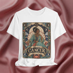 White t-shirt with Cancer zodiac design on a maroon fabric background