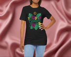 Woman wearing a black t-shirt with 'Gemini' design featuring flowers and leaves on a maroon fabric background