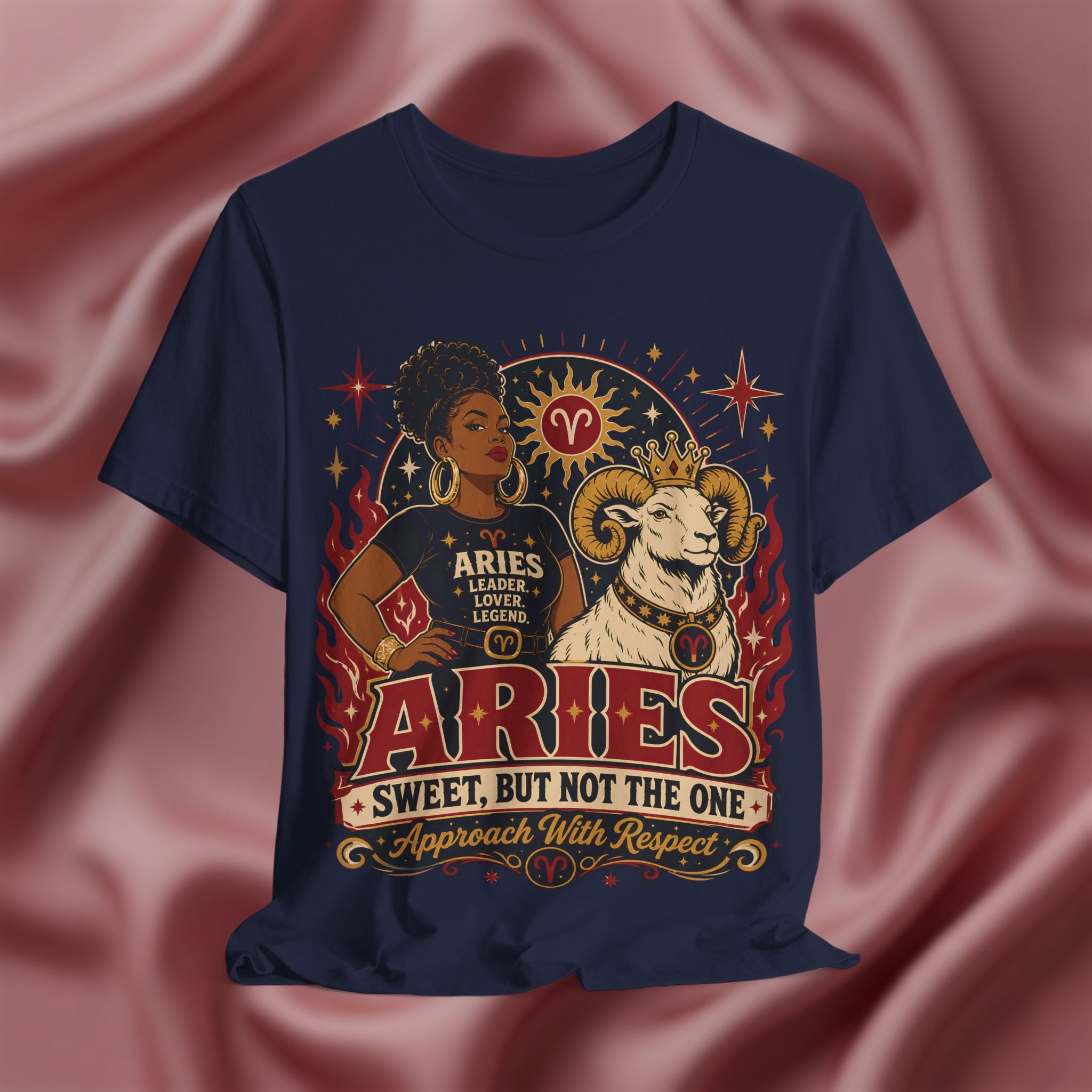 Navy blue t-shirt with Aries zodiac design on a pink fabric background