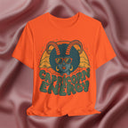 Orange t-shirt with Capricorn energy design on a textured brown background