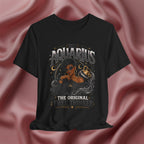 Black t-shirt with Aquarius design featuring a black woman and text 'The original free thinker' on a pink fabric background