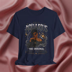 Navy blue t-shirt with Aquarius design featuring a black woman and text 'The original free thinker' on a pink fabric background