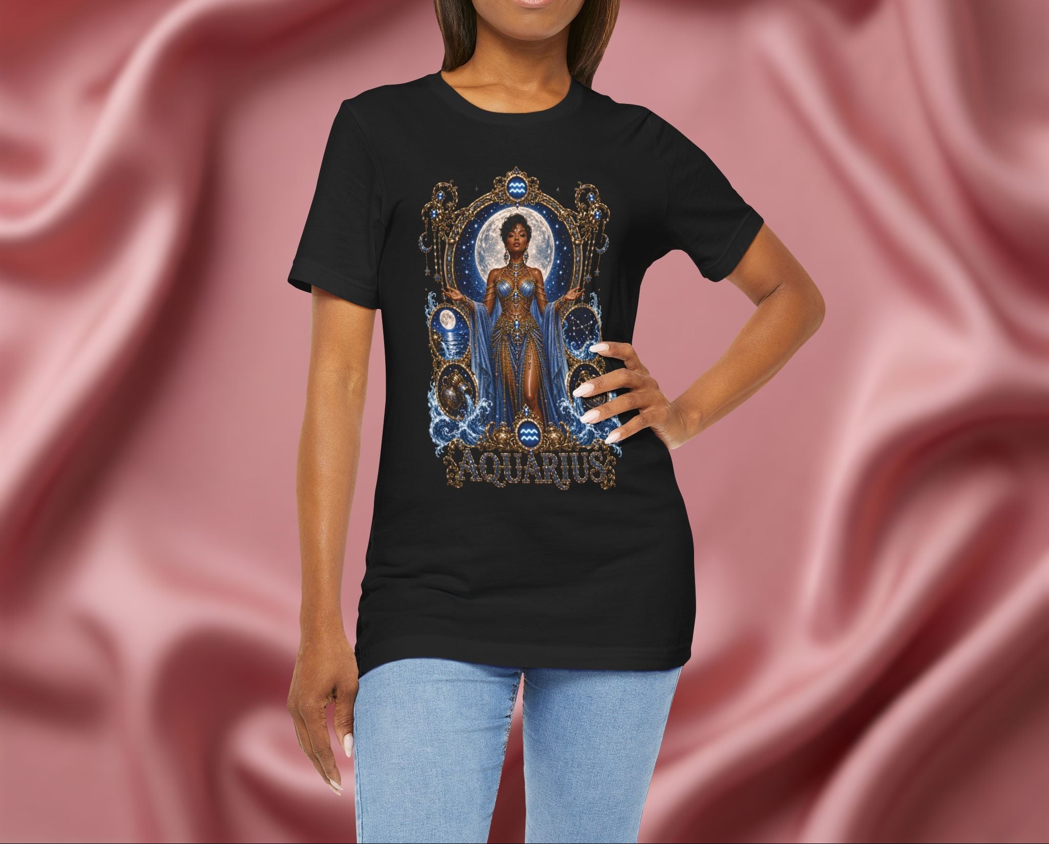 Woman wearing a black t-shirt with 'Aquarius' design featuring a woman in a blue dress on a pink fabric background