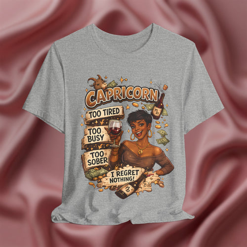 Gray t-shirt with Capricorn zodiac design on a pink fabric background