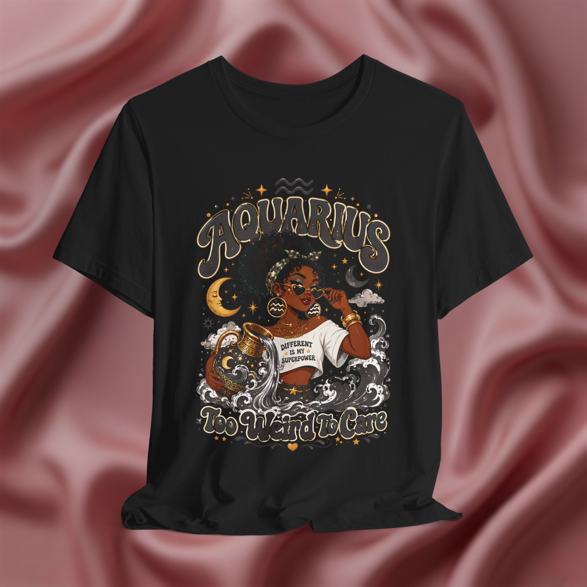 Black t-shirt with 'Aquarius Too Weird To Care' design featuring a black woman wearing a t-shirt with the text 'different is my superpower' on a pink fabric background