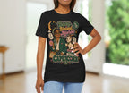 Woman wearing a black t-shirt with colorful Capricorn woman graphics and text.