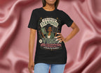 Person wearing a black t-shirt with Virgo graphic design and text, standing against a pink fabric background