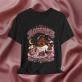 Black t-shirt with 'Aquarius Too Weird To Care' design featuring a black woman wearing a t-shirt with the text 'different is my superpower' on a pink fabric background