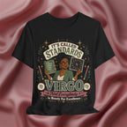 Black t-shirt with Virgo zodiac design on a pink fabric background