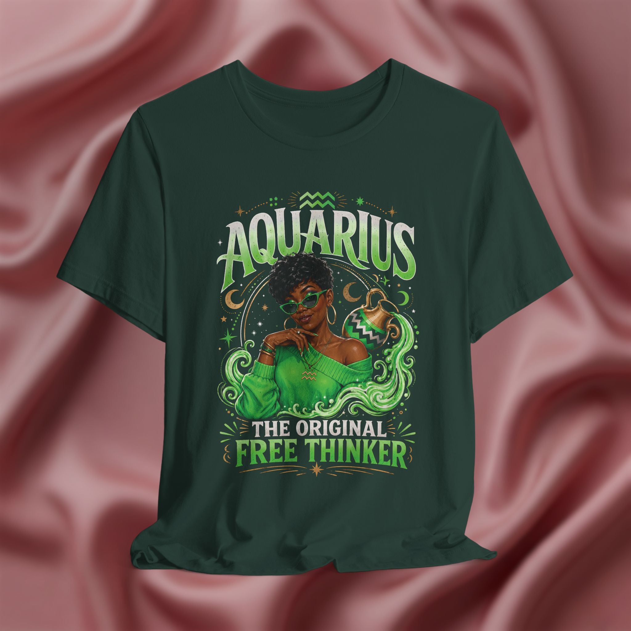Green t-shirt Pink t-shirt with Aquarius design featuring a black woman and text 'The original free thinker' on a pink fabric background