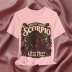 Pink t-shirt with Scorpio zodiac design on a maroon fabric background