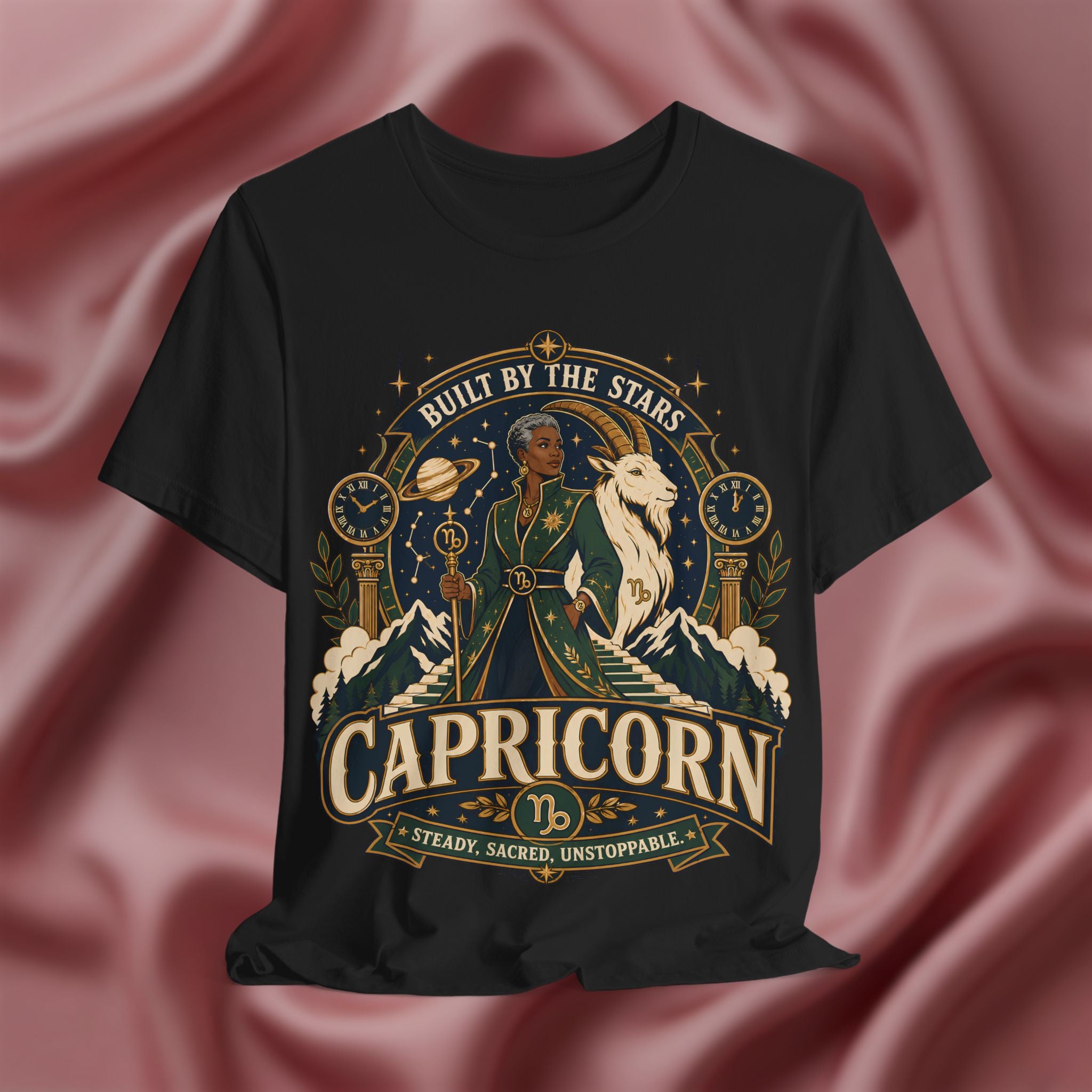 Black t-shirt with Capricorn zodiac design on a pink fabric background