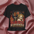 Black t-shirt with Aries zodiac design on a pink fabric background