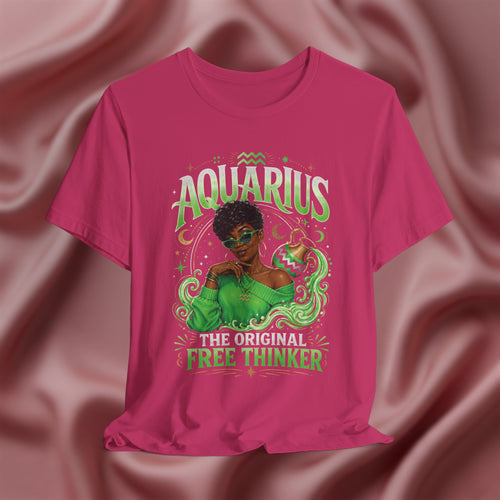 Pink t-shirt with Aquarius design featuring a black woman and text 'The original free thinker' on a pink fabric background