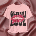 Pink t-shirt with 'GEMINI LOVE' design on a textured pink background
