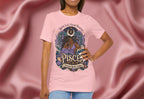 Person wearing a pink t-shirt with a Pisces zodiac design on a pink fabric background