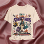 Soft cream T-shirt with Sagittarius zodiac design on a textured red background