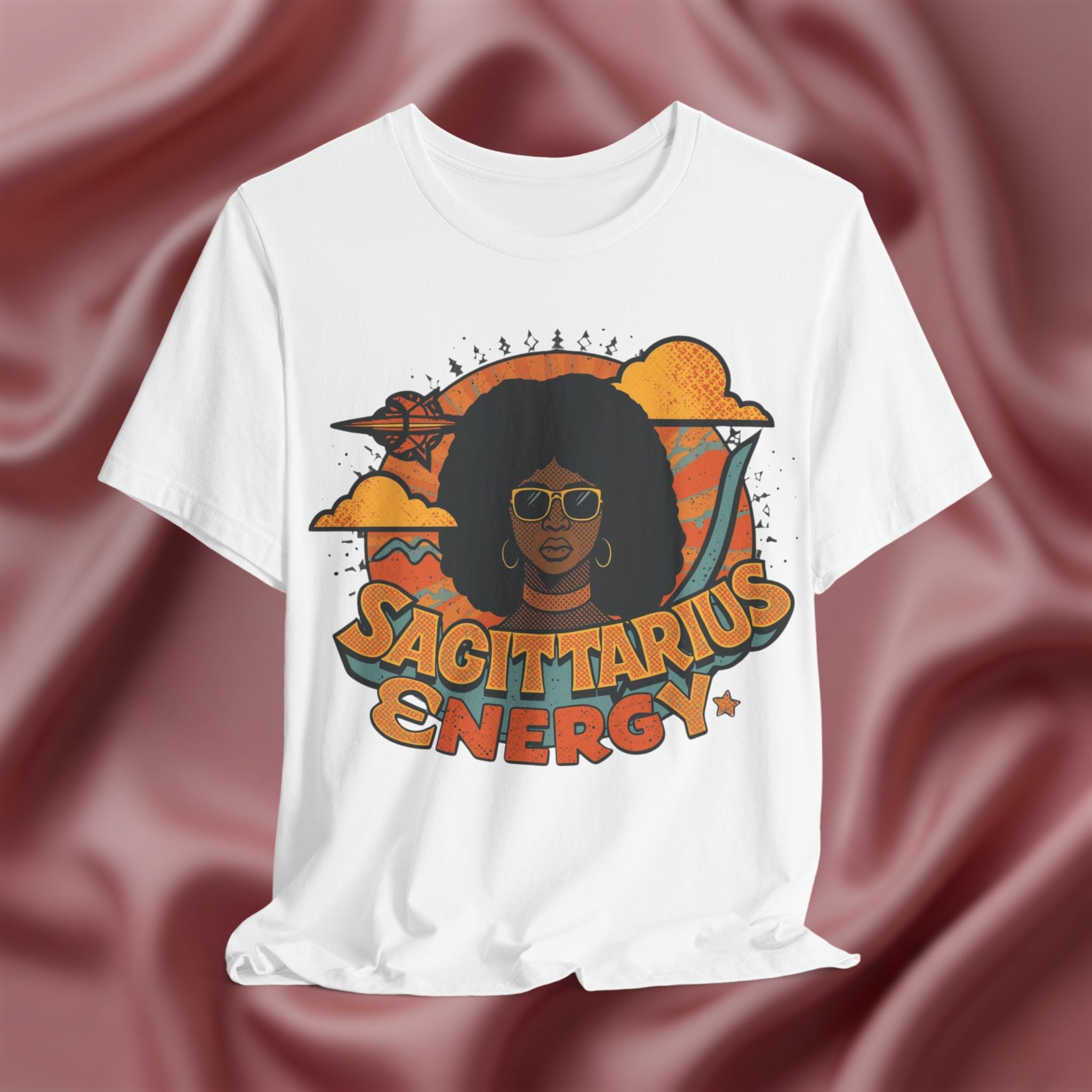 White t-shirt with a graphic design featuring a woman with an afro and the text 'Sagittarius Energy' 