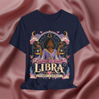 Navy blue t-shirt with Libra zodiac design on a pink fabric background