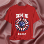 Red t-shirt with with American flag sunflower and 'GEMINI ENERGY' text on a textured pink background
