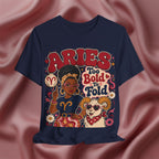 Navy blue t-shirt with Aries zodiac design on a pink fabric background