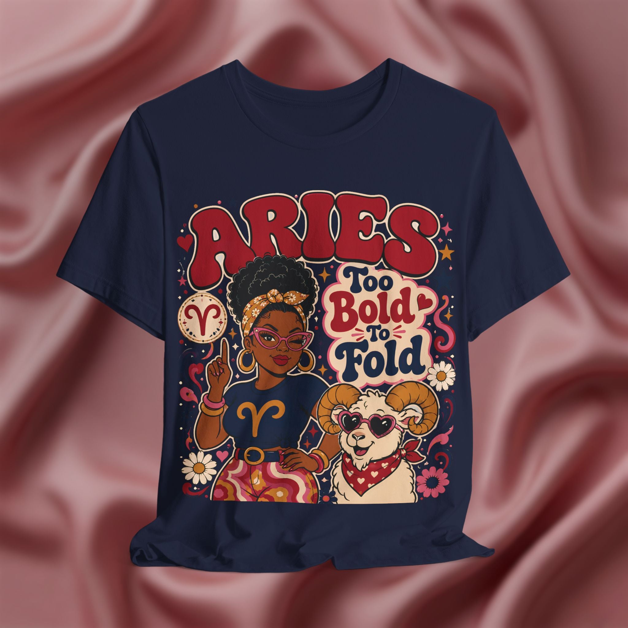 Navy blue t-shirt with Aries zodiac design on a pink fabric background