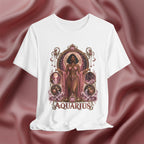 White t-shirt with 'Aquarius' design featuring a woman in a pink dress on a pink fabric background